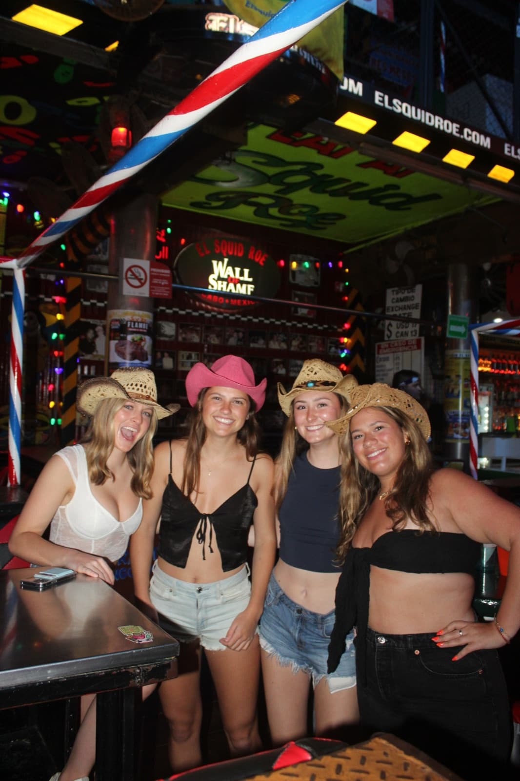 Bachelorette party group in cowboy hats at El Squid Roe Cabo