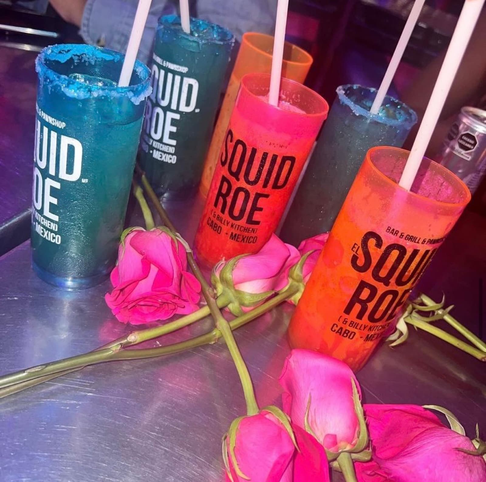 Billyxology margaritas in souvenir cups at El Squid Roe Cabo San Lucas