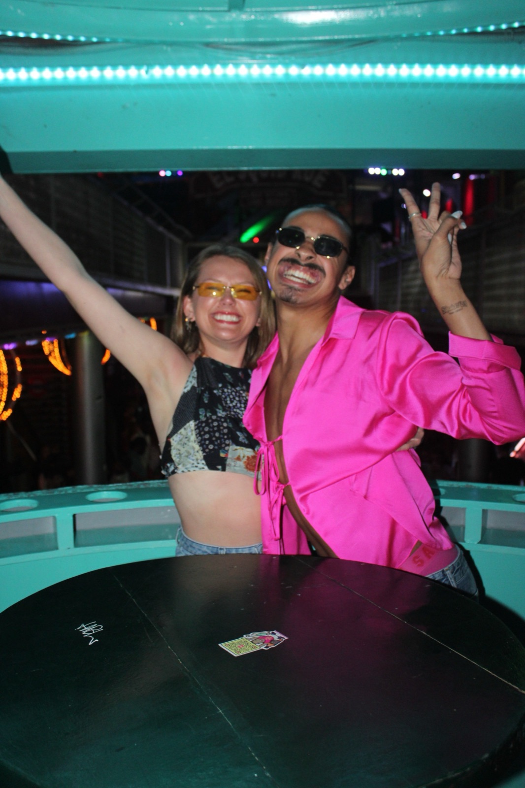 Couple celebrating together on the dance floor at El Squid Roe Cabo San Lucas
