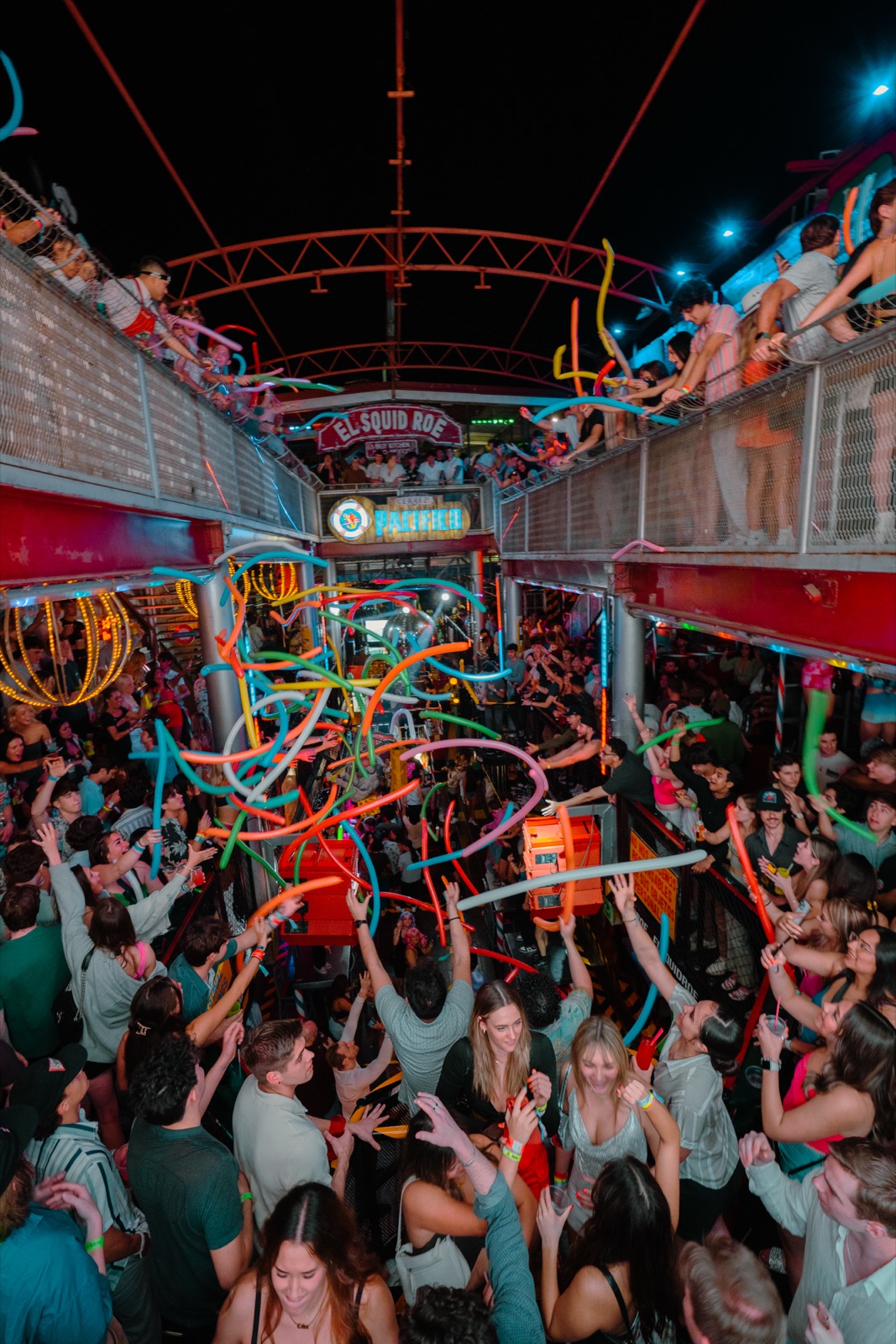 Packed Spring Break crowd at El Squid Roe in Cabo San Lucas with balloons dropping over the dance floor